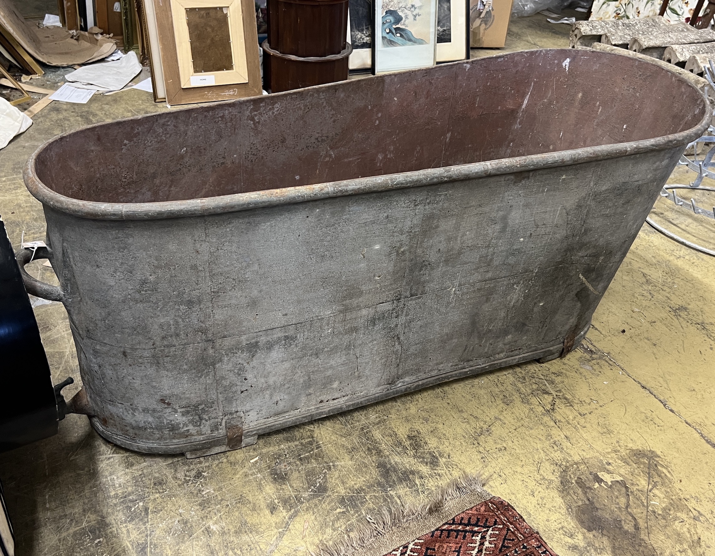 A vintage French galvanised bath, length 150cm, height 60cm